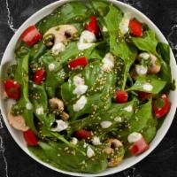 Pesto Masters · spinach, artichokes, tomatoes, sauteed mushrooms, pesto, sesame seeds, and ranch dressing