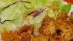 Orange Chicken  · Served with rice and salad.