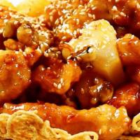 Honey Glazed Walnut Chicken · Chicken lightly battered & served in a crispy noodles basket with walnuts and a honey glazed...