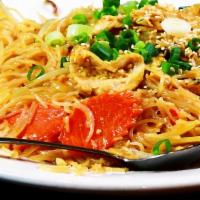 Singapore Noodles · Thin rice noodles, sautéed with vegetables and curry sauce, topped off with sesame seeds.