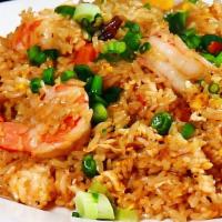 Pineapple Fried Rice · A vividly delectable combination of diced carrots, peas and cubed pineapples.