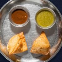 Samosa Persona · Savory pastry filled with potatoes and peas and fried to perfection