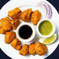 Chicken Pakora · Filled with green chutney, marinated in yogurt, ginger, garlic and butter and fried to perfe...