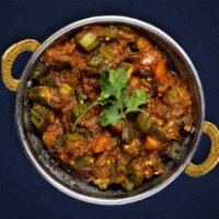 The Big Bang Bhindi · Fresh okra with sliced onions, herbs, and mild spices. Served with rice.