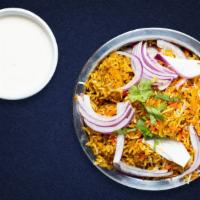 Rad Vegetable Biryani · Spiced seasoned vegetables cooked with Indian spices and basmati rice. Served with house rai...