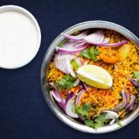 Lamb Biryani · Juicy lamb cooked with Indian spices and basmati rice. Served with house raita.