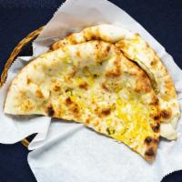 There'S Naan Better · Leavened flatbread made from white flour, cooked until puffy and blistering, then coated in ...