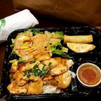 Teriyaki Chicken Bento Box · Cucumber scallion and sesame seed. served with white rice salad spring roll and gyoza.