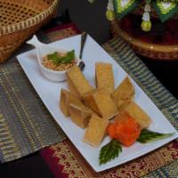 Fried Tofu · Fresh tofu deep fried serve with Thai sweet chili sauce topped with crushed peanuts.