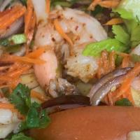 Seafood Salad · Shrimps, squids, green mussels, green onion, cilantro, tomato in chili paste lime dressing.