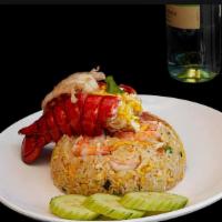 Lobster Fried Rice. · Lobster, shrimp, jasmine rice, onion, tomato, green onion, cilantro.