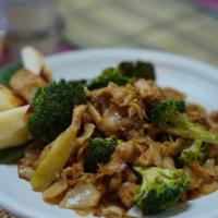 Pad See-Ew (Recommended) · Flat wide noodles stir-fried with Chinese broccoli, eggs topped with fried garlic
