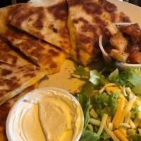 Dlv - Coyote Quesadilla · Quesadilla made with flour tortilla and a blend of four cheeses, topped with sour cream and ...