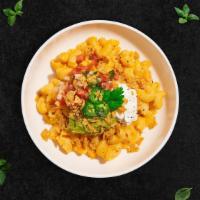 Fiesta Mac And Cheese · A mac and cheese that's fit for a fiesta. Guacamole, jalapenos, pico de gallo, sour cream, c...