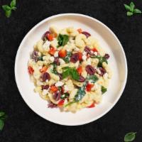 Mediterranean Love Story · This mac and cheese is a mediterranean love story. Fresh diced tomatoes, olives, spinach coo...