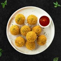 Cheesy Mac And Cheese Bites · Fried bites of melt in your mouth mac and cheese. A delicious comfort food side.