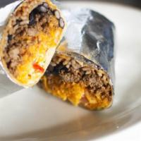 Carne Asada Burrito · A flour tortilla filled with charbroiled skirt steak, beans and rice. Topped with lettuce, p...