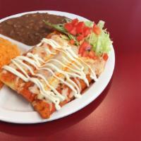 Enchiladas Plate Combo · Your choice of 3 green or red enchiladas, rice, and beans on the side topped with sour cream.