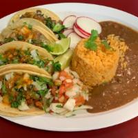 Crunchy Taco Plate · Two crunchy tacos, your choice of meat, side of rice and beans.