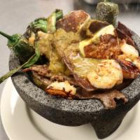 Molcajete Combo · Includes Beef, chicken, 5 pieces of shrimp, slice of Mexican cheese queso fresco, topped wit...