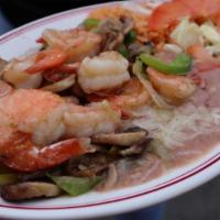 Camarones Al Ajo · Shrimp in a buttery garlic sauce comes with onions, bell pepper, and mushrooms with a side o...