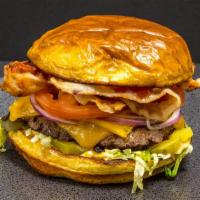 The Bronx Bomber · A 5oz All beef patty covered in Colby Jack cheese, Thick cut bacon, Red Onions, lettuce,  to...