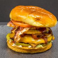 The Brooklyn Broiler · A 5oz Beef patty covered in Cheddar cheese, Thick cut bacon, Fried onions, lettuce,  tomato,...
