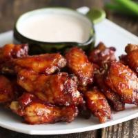 Block Party Bbq Wings · Crispy wings slathered in your choice of sweet honey or traditional smoked BBQ sauce