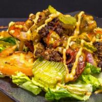 Wall St Burger Bowl · Our Original Cheeseburger salad tossed with grilled onions, roasted peppers, and jalapeños o...