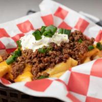 Tribeca Chili Cheese Fries · Lemon pepper seasoned fries loaded with cheddar cheese, chili, green onions, sour  cream and...