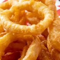 Jumbo Jet Onion Rings · Crispy fried onion rings paired with our house special garlic dipping sauce.