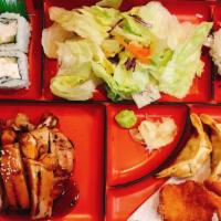 Deluxe Bento · Chicken teriyaki, California rolls 4 pieces , prawn katsu (2 pieces), gyoza (2 pieces), and ...