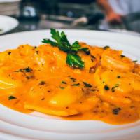 Lobster Ravioli · Fresh  ravioli stuffed with lobster served in a lobster brandy cream sauce.