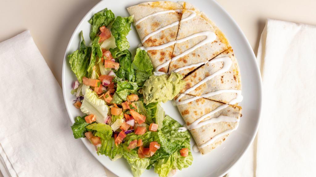 Chicken Quesadilla · House seasoned roasted chicken, pepper jack cheese, sauteed peppers, onions, and spicy chipotle mayo. Served with a side salad and guacamole