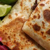 Veggie Quesadilla · 10” flour tortilla, melted cheese, mushrooms marinated in adobo. Toppings include; cilantro,...