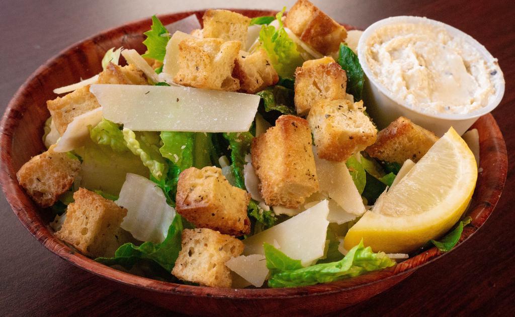 Small Caesar Salad · Romaine, parmesan, croutons and lemon wedges. Your choice of dressing.