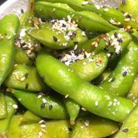 Edamame · Vegan. Broiled green soy beans sprinkled with salt. Vegan.