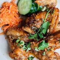 Peek Gai Tod (4) · fried chicken wings in your choice of tamarind glaze or northern laab spices (very spicy) GF