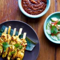 Smoked Chicken Satay (4) · served with cucumber relish and peanut curry dipping sauce GF