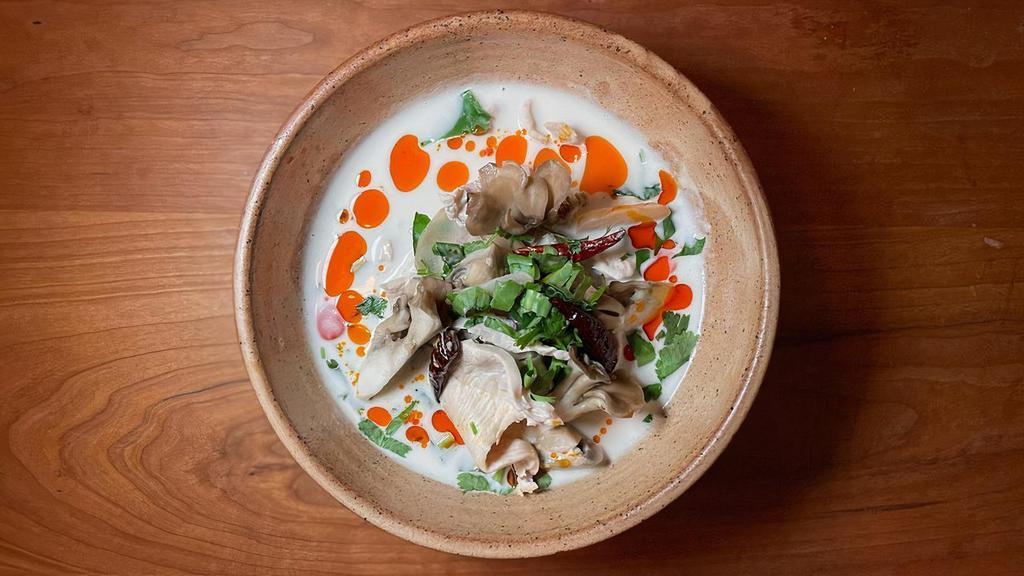 Tom Kha Gai · coconut milk soup with chicken, oyster mushroom, galangal, makrut lime, scallion, cilantro GF