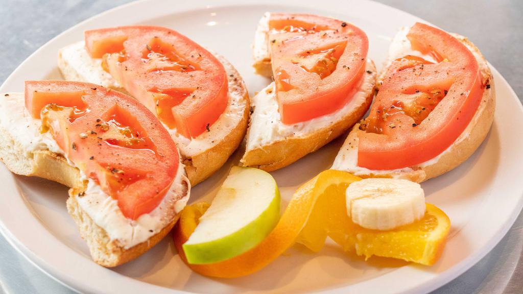 The Usual · Toasted bagel, cream cheese, sliced tomato, and cracked pepper.
