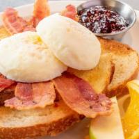 Poached Eggs And Toast · Eggs poached soft, medium, or hard, buttered toast and a side of raspberry jam.