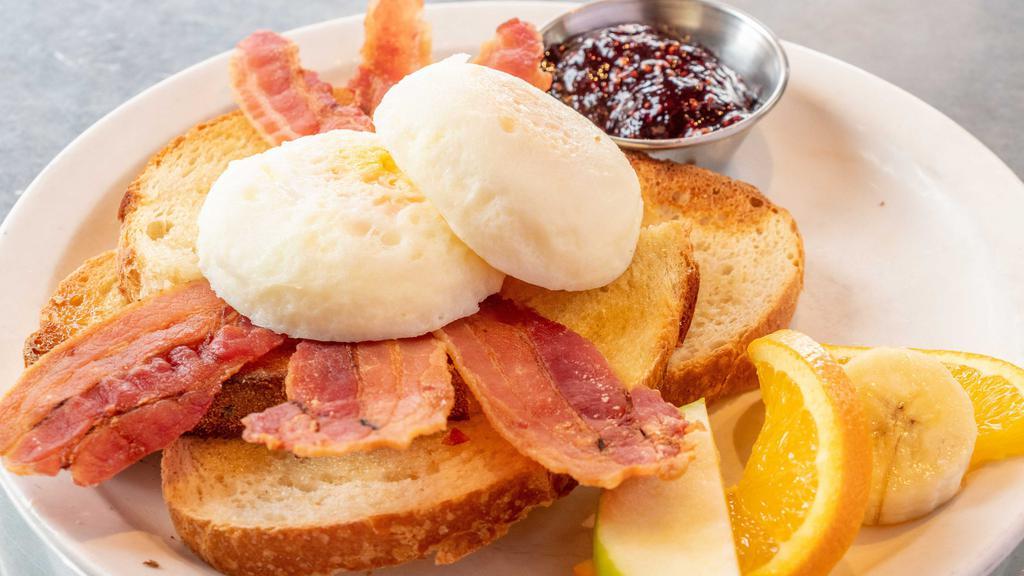 Poached Eggs And Toast · Eggs poached soft, medium, or hard, buttered toast and a side of raspberry jam.