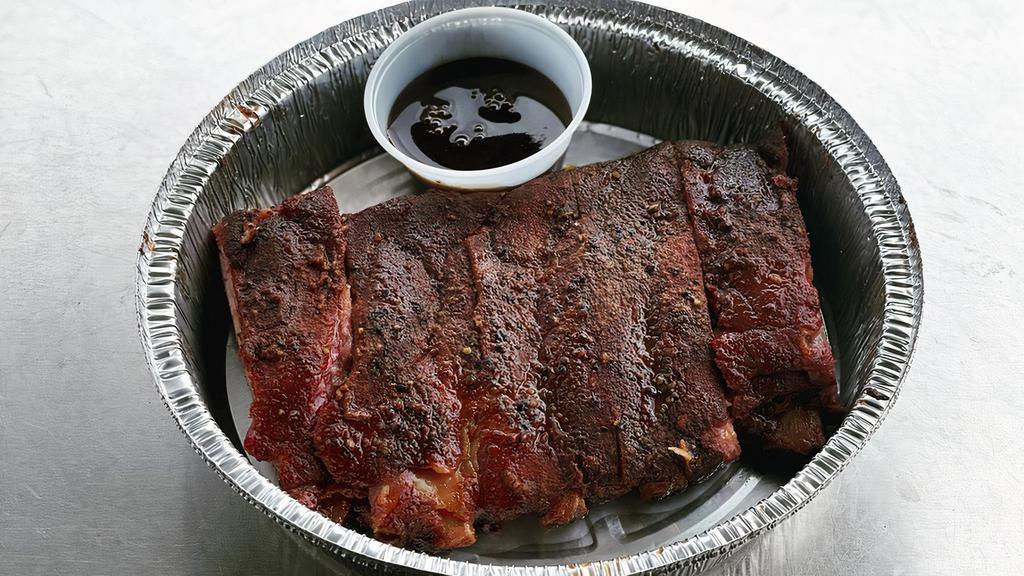 Ribs · St. Louis cut spare ribs seasoned with Salt City Pork Rub smoked over pecan wood.  It comes with a side of Salt City BBQ Sauce.