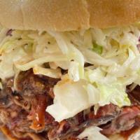Bbq Sandwich  · Slow-smoked brisket, topped with made from scratch BBQ sauce and Coleslaw in between a local...