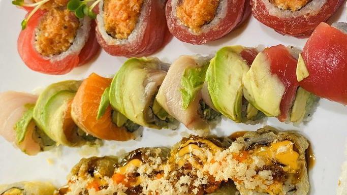Rainbow Roll · Kani, cucumber and avocado inside, topped with sashimi fish.
