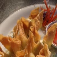 Crab Rangoon (6) · Imitation crab meat and cream cheese wrapped in wonton skin served with sweet and sour sauce.