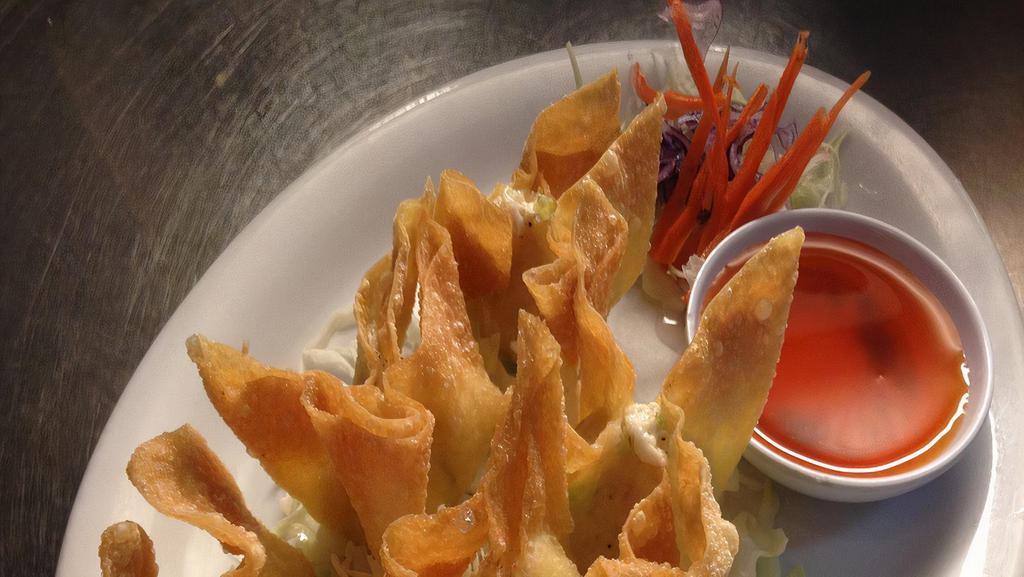 Crab Rangoon (6) · Imitation crab meat and cream cheese wrapped in wonton skin served with sweet and sour sauce.