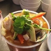 Tum Yum Seafood · Squid, mussels, scallops, shrimp, fish, mushrooms and tomatoes in a spicy lime flavor broth