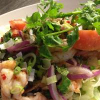 Shrimp Salad (Pla-Goong) · Grilled shrimp tossed with lemon grass, cilantro and onions mixed with a spicy dressing.